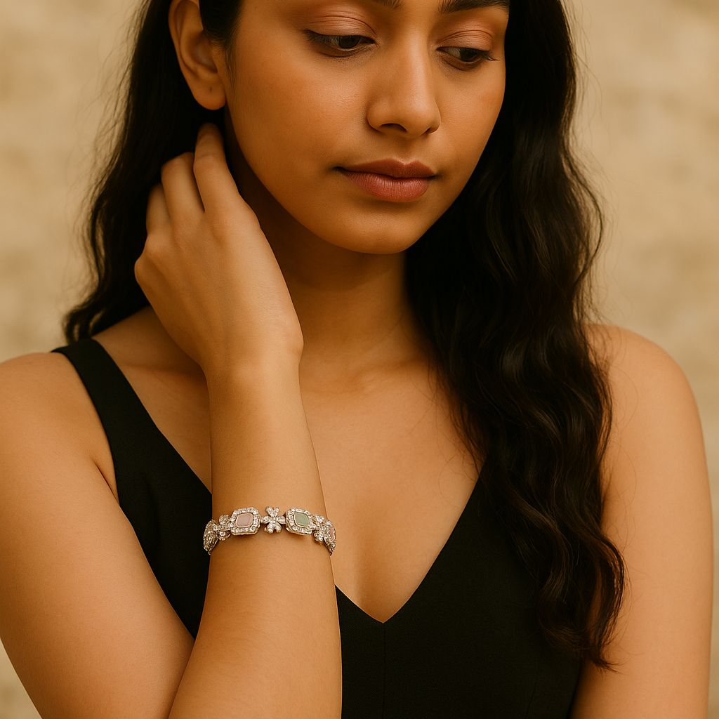 Woman wearing a black dress and silver bracelet against a beige background. Brand: Oplique By Vineeta