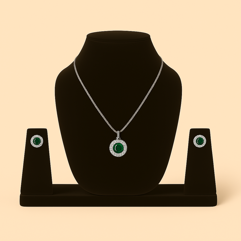 Jewelry set featuring a necklace and earrings with green gemstones on a black stand against a beige background. Brand: Oplique By Vineeta