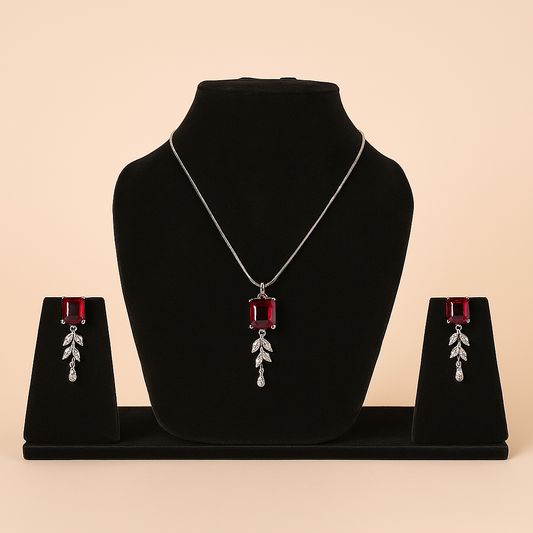 Jewelry set with necklace and earrings on a black velvet stand against a beige background. Brand: Oplique By Vineeta