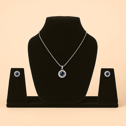 Jewelry set with necklace and earrings on a black stand against a beige. Brand: oplique By Vineeta background